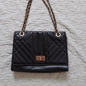 Black faux leather crossbody purse with adjustable stap and art deco pattern